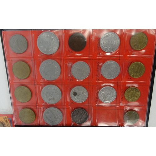 416 - Two albums of world coins, including Maundy coins, pennies, half pennies, francs etc.