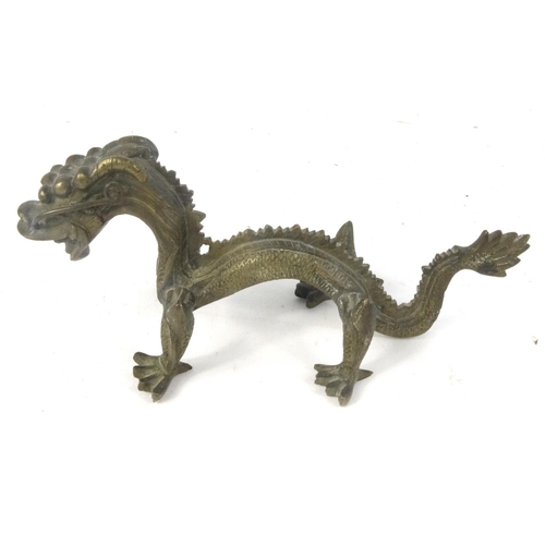 456 - Oriental carved wooden figure on a buffalo, soapstone carving and a brass dragon