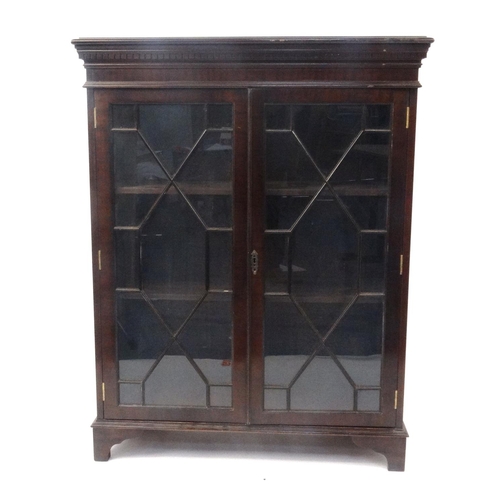 155 - Mahogany bookcase fitted with a pair of astragal glazed doors, 117cm high x 91cm wide x 34cm deep