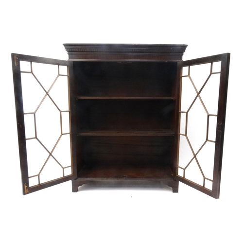 155 - Mahogany bookcase fitted with a pair of astragal glazed doors, 117cm high x 91cm wide x 34cm deep