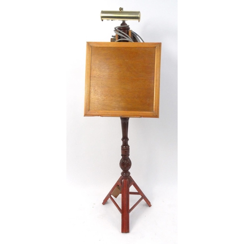 68 - Carved wooden music stand with brass reading lamp, 143cm high