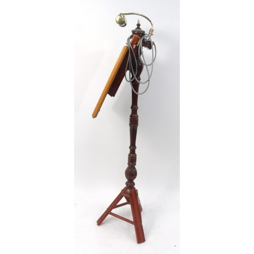 68 - Carved wooden music stand with brass reading lamp, 143cm high