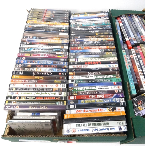 231 - Four boxes of assorted DVD's and a small selection of CD's