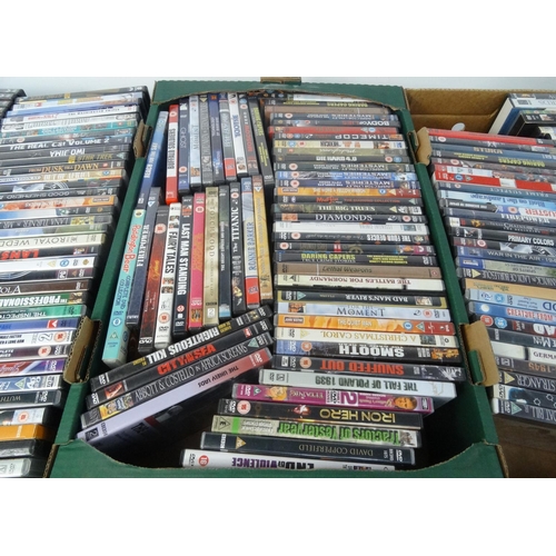 231 - Four boxes of assorted DVD's and a small selection of CD's