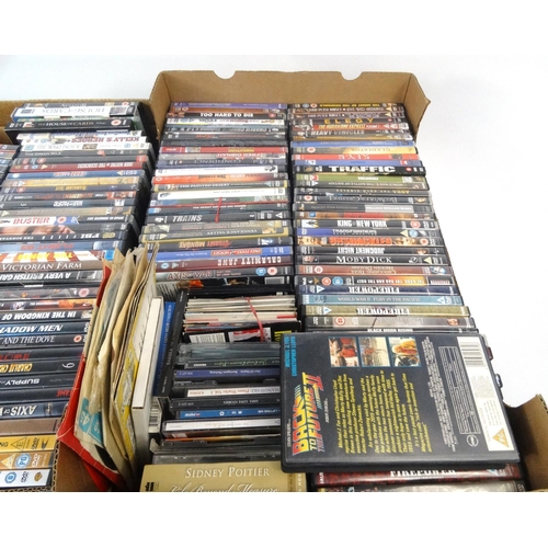 231 - Four boxes of assorted DVD's and a small selection of CD's