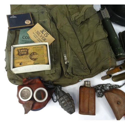 620 - Box of military items, including tin helmet, ammunition belt, gas mask, enamelled bottle etc.