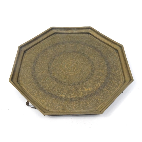 238 - Heavy Middle Eastern octagonal brass tray, profusely decorated with bands of figures, 57.5cm diamete... 