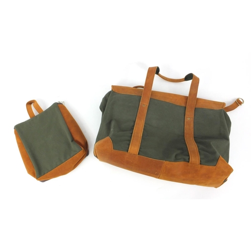 311 - Two Sand Storm canvas and leather bags, the largest 60cm wide