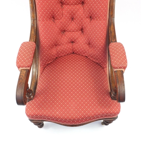 2027 - Victorian Oak framed elbow chair with burgundy button backed upholstery and fluted legs, 92cm high