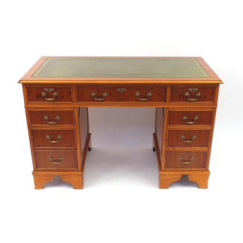 2004 - Yew wood twin pedestal desk with green tooled leather top, 79cm high x 121cm wide x 60cm deep