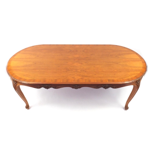 2014 - French style carved Walnut dining table together with eight chairs including two carvers, all with g... 