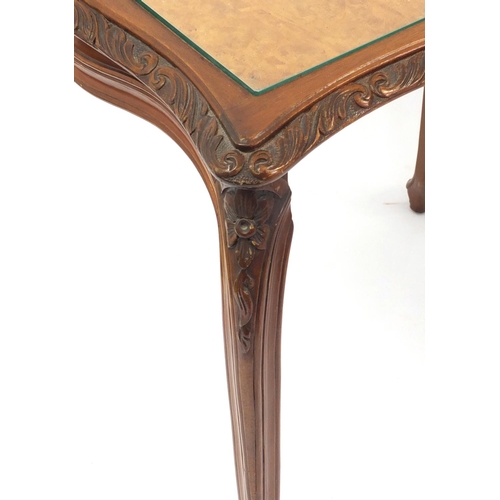 2021 - French style nest of three carved Burr Walnut occasional tables with glass tops, tallest 62cm high
