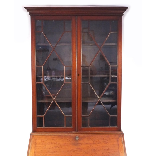 2011 - Late Victorian mahogany bureau bookcase fitted with a pair of astragal glazed doors above a fall rev... 