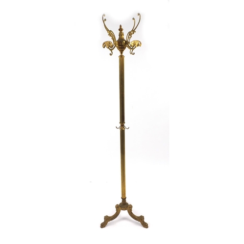 2052 - Ornate brass rotating coat stand, 145cm high