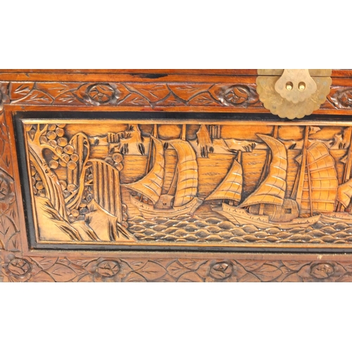 2049 - Oriental Chinese carved camphorwood trunk carved with panels of shipping scenes, 61cm high x 101cm w... 