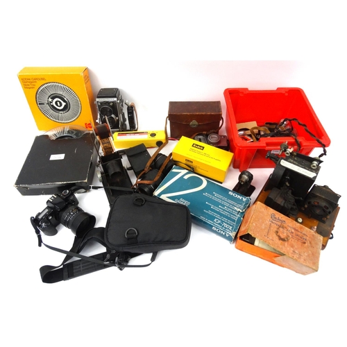 255 - Large selection of photographic equipment including Kodak carousels, some cameras, lenses and filter... 