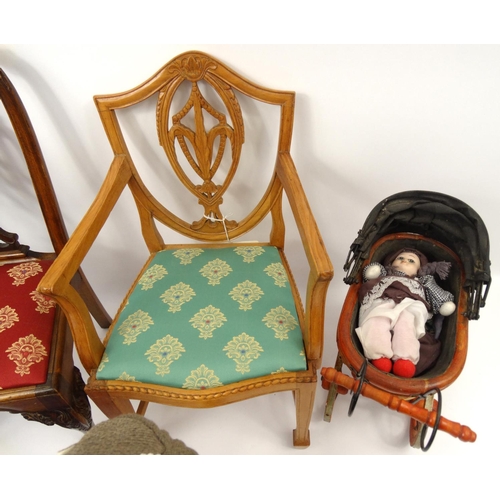 274 - Dolls and accessories including a boy and a girl on a stand, two dolls prams and two dolls chairs