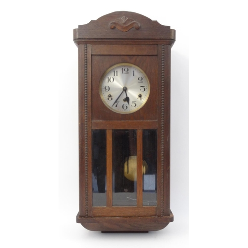 308 - Oak cased wall hanging clock with Westminster chime, 78cm high