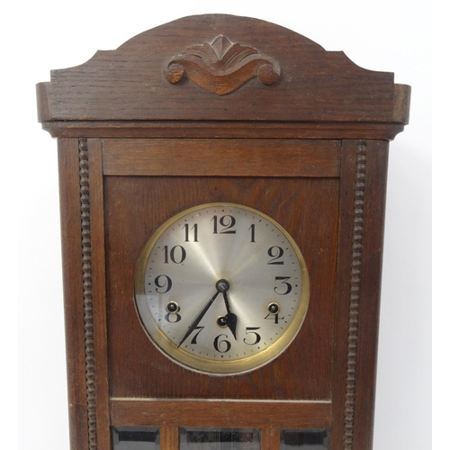 308 - Oak cased wall hanging clock with Westminster chime, 78cm high