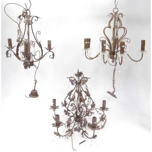 162 - Three ornate metal chandeliers with glass drops, the larger 60cm high excluding the chain