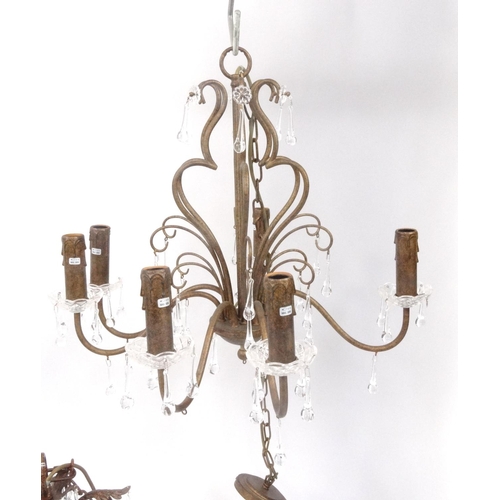 162 - Three ornate metal chandeliers with glass drops, the larger 60cm high excluding the chain