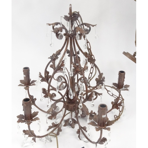 162 - Three ornate metal chandeliers with glass drops, the larger 60cm high excluding the chain