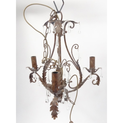 162 - Three ornate metal chandeliers with glass drops, the larger 60cm high excluding the chain