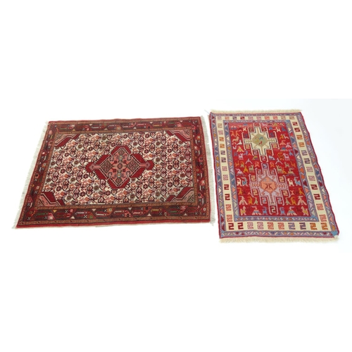 129 - Two small geometric patterned rugs, the larger 120cm x 80cm