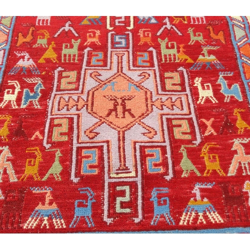 129 - Two small geometric patterned rugs, the larger 120cm x 80cm