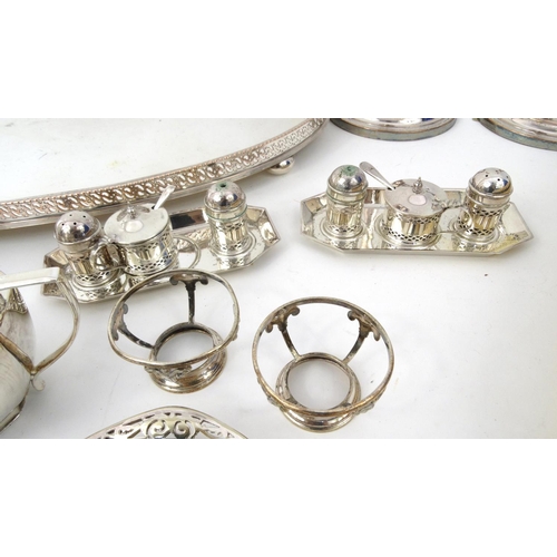 218 - Small selection of silver plated items including a tray, a pair of candlesticks, cruets, cutlery etc... 