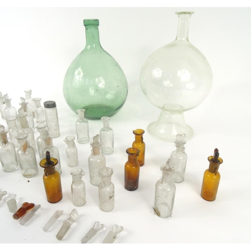 261 - Two large antique glass bottles and a selection of small antique glass medicine bottles