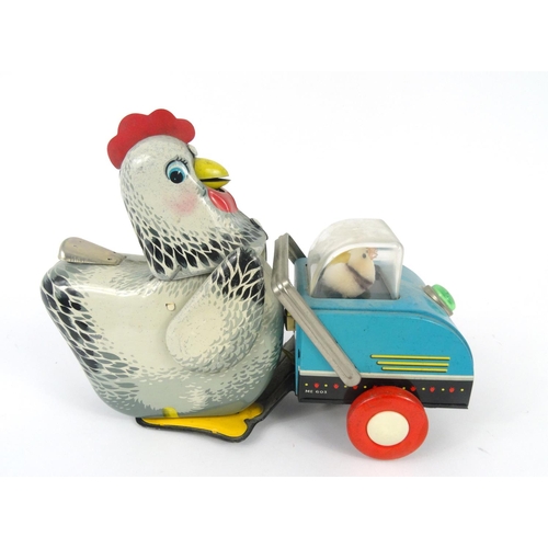 562 - Vintage tin plate clockwork chicken toy, 26cm long