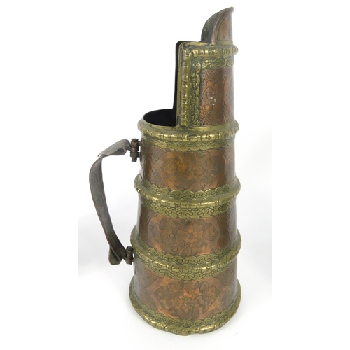 545 - Middle eastern copper and brass vessel, two pewter tankards and a pewter cup