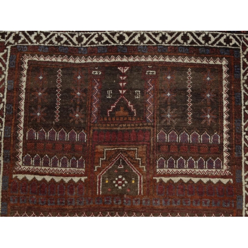 74 - Rectangular Middle Eastern prayer mat with geometric and floral border, the central field decorated ... 