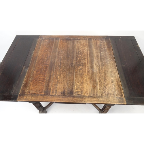 97 - Oak drawleaf dining table with barleytwist legs, 73cm high x 106cm square