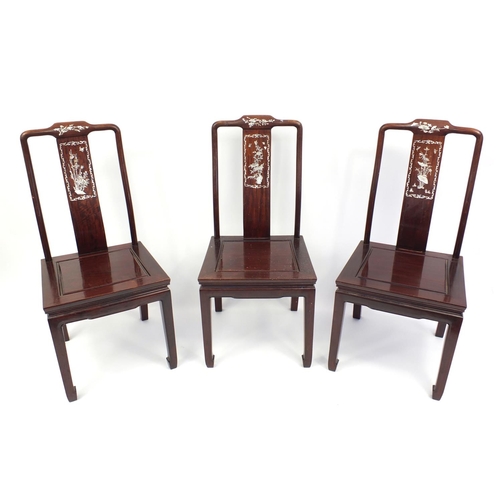 135 - Three oriental Chinese hardwood chairs all with mother of pearl inlay, each 98cm tall