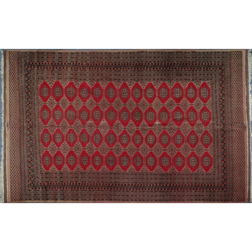 158 - Large rectangular Middle Eastern carpet with geometric border, the central field decorated with a co... 