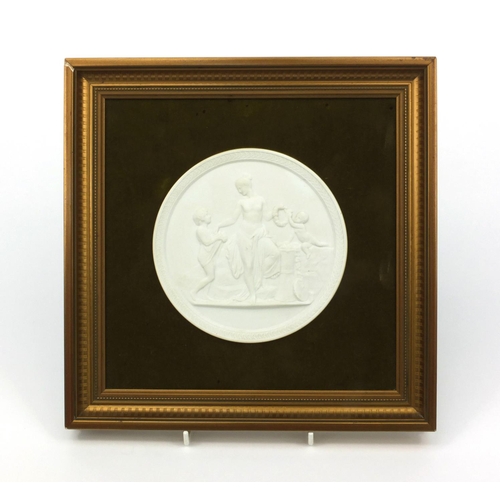 331 - Framed Royal Copenhagen Parian plaque of a robed lady with putti and a child, the plaque 14cm diamet... 