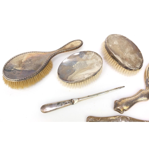 358 - Group of five silver backed vanity items together with a silver handled paper knife various hall mar... 