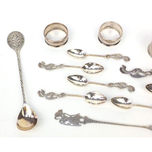 359 - Group of silver and silver coloured metal items, including three silver napkin rings and a group of ... 