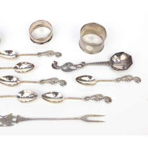 359 - Group of silver and silver coloured metal items, including three silver napkin rings and a group of ... 