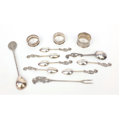 359 - Group of silver and silver coloured metal items, including three silver napkin rings and a group of ... 