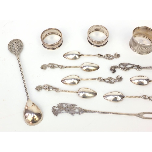 359 - Group of silver and silver coloured metal items, including three silver napkin rings and a group of ... 