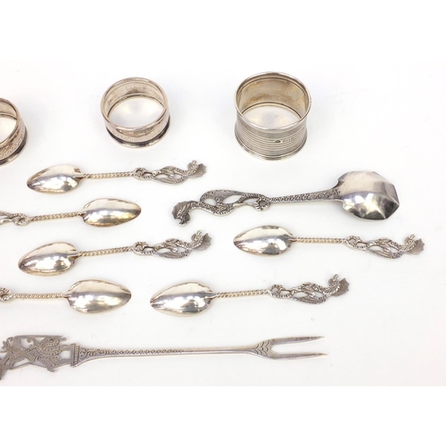 359 - Group of silver and silver coloured metal items, including three silver napkin rings and a group of ... 