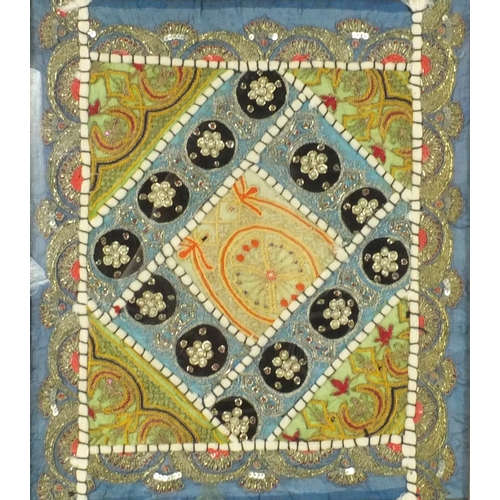 549 - Two Middle Eastern embroidered and beaded fabric panels with geometric designs, both framed, each 36... 