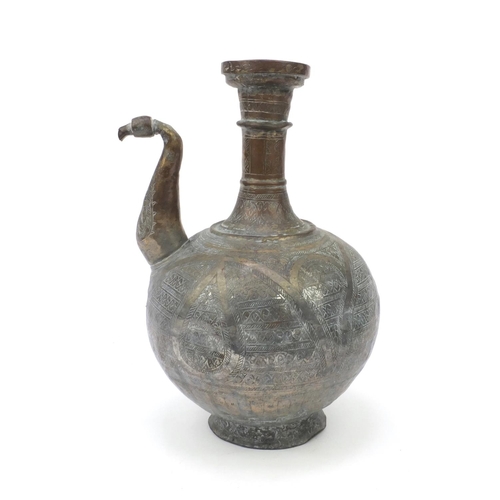 558 - Middle Eastern silvered metal brass water pot with chased abstract design, 36cm high