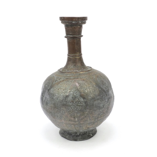 558 - Middle Eastern silvered metal brass water pot with chased abstract design, 36cm high