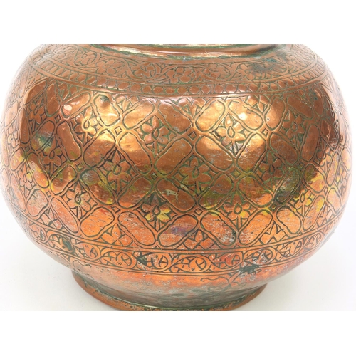 564 - 19th Century Middle Eastern copper floral chased water pot, 33cm high