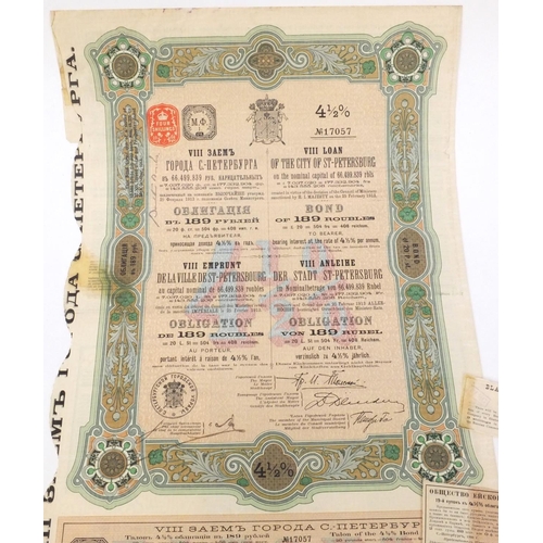 595 - Six Russian share certificates, some with attached bonds and stamps, the largest 41cm x 28cm