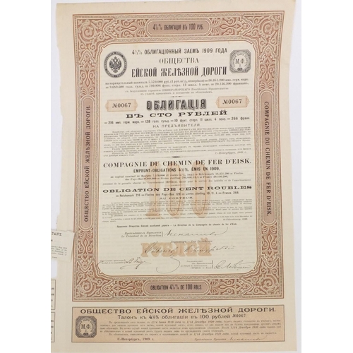 595 - Six Russian share certificates, some with attached bonds and stamps, the largest 41cm x 28cm